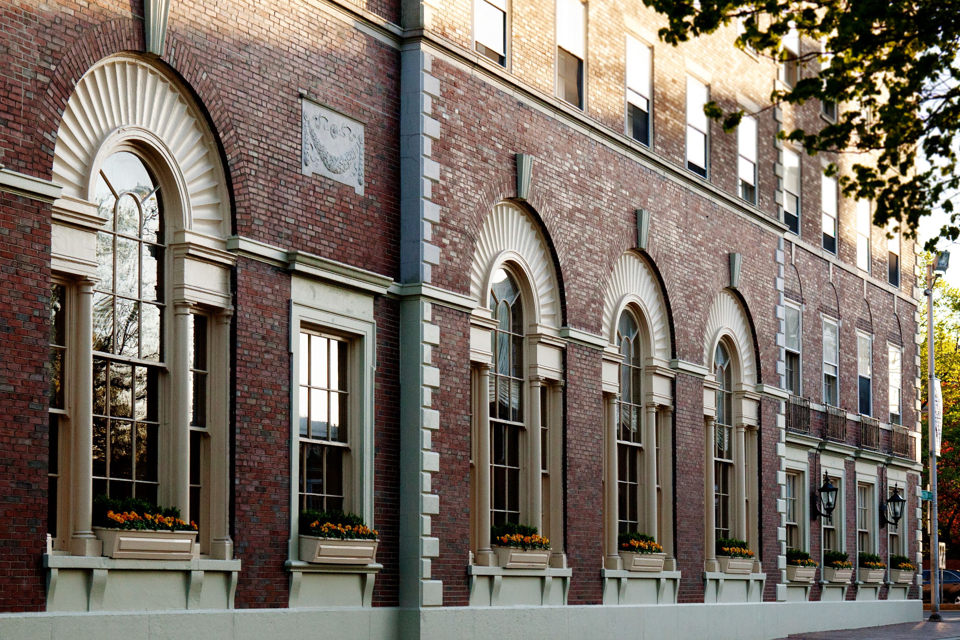 Image of Exterior Detail at the Hawthorne Hotel featuring arch windows and brick wall. Hawthorne Hotel, a member of Historic Hotels of America since 1991, located in Salem, Massachusetts